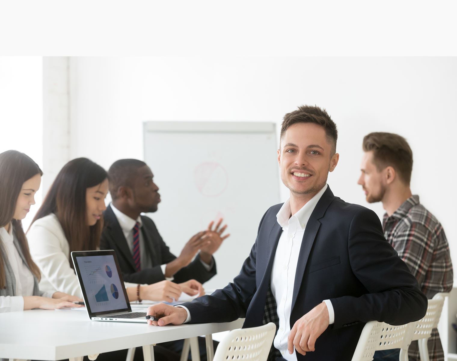 Business man smiling in meeting