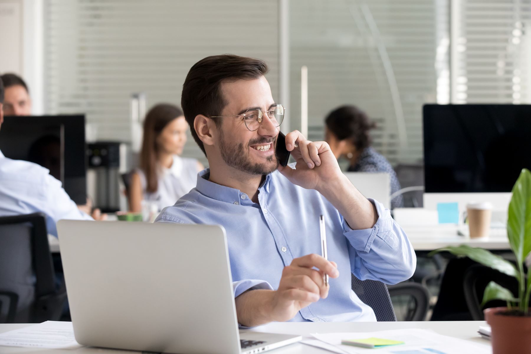 Business man using work phone